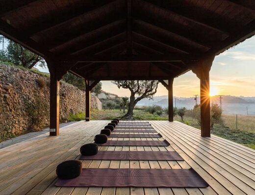 Yoga mats under an outdoor hut at La Mezquita Retreats in El Campello, Alicante, Spain.
