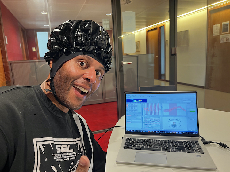 Neuroscience student Zeus Tipado showing data from his fNIRS treatment