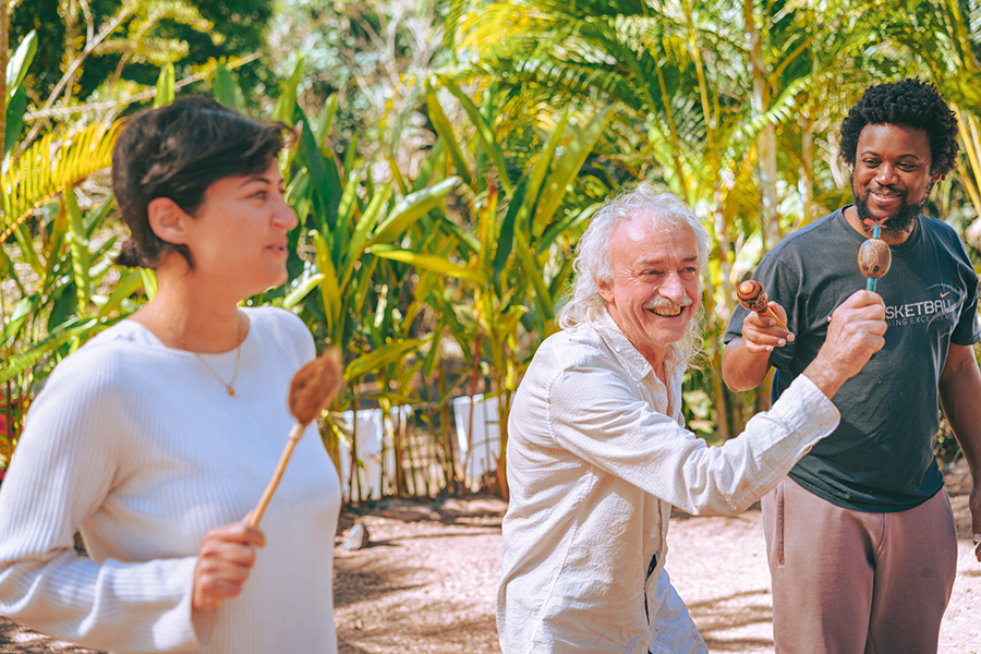 Participants using maracas at Soul Medicine in Nayarit, Mexico.