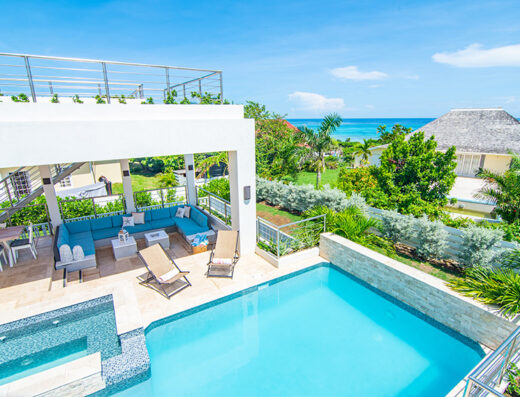 Pool and beach at EQNMT Psilocybin Retreat in Jamaica.
