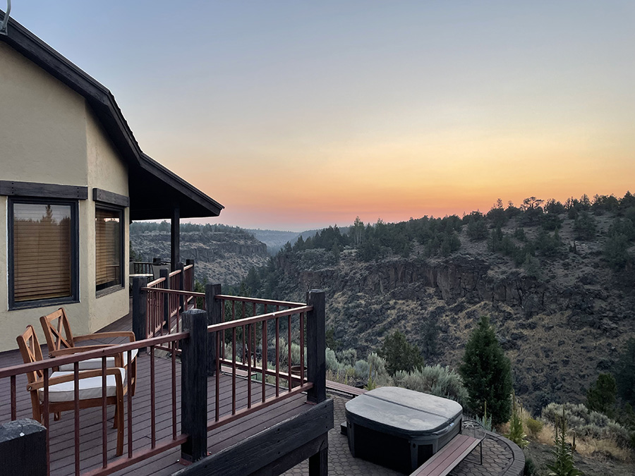 A cabin overlooking mountains at Odyssey Psilocybin Retreats in Oregon.
